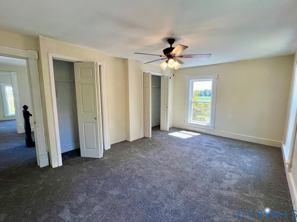 40 Coan Wharf Road Heathsville, VA 22473 - Photo 21 of 28 an empty room with windows and fan