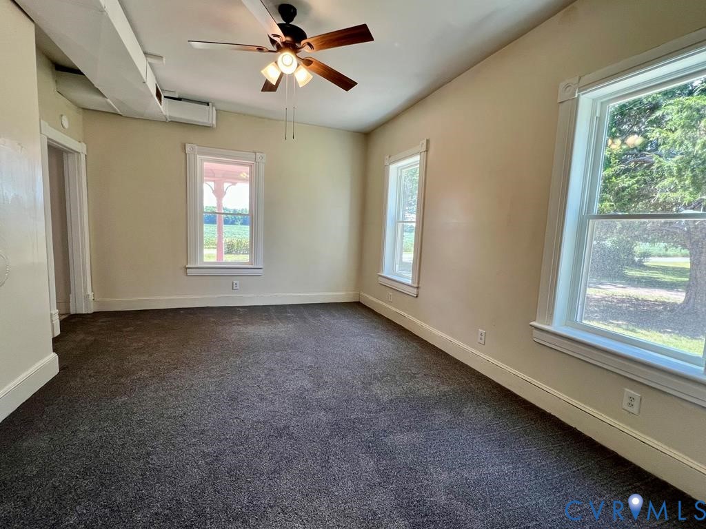 40 Coan Wharf Road Heathsville, VA 22473 - Photo 23 of 28 a view of a livingroom with a ceiling fan and window