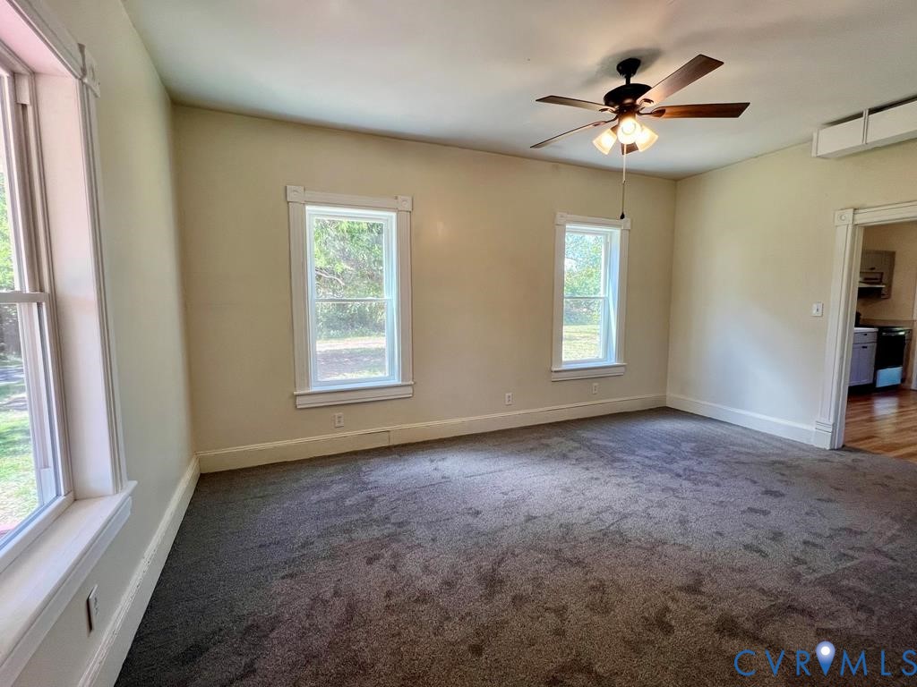 40 Coan Wharf Road Heathsville, VA 22473 - Photo 8 of 28 wooden floor in an empty room with a window