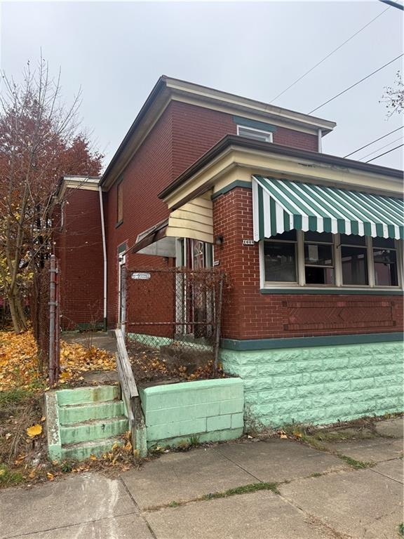 1008 Collier Street Pittsburgh, PA 15208 - Photo 3 of 10 a front view of a house with a garden