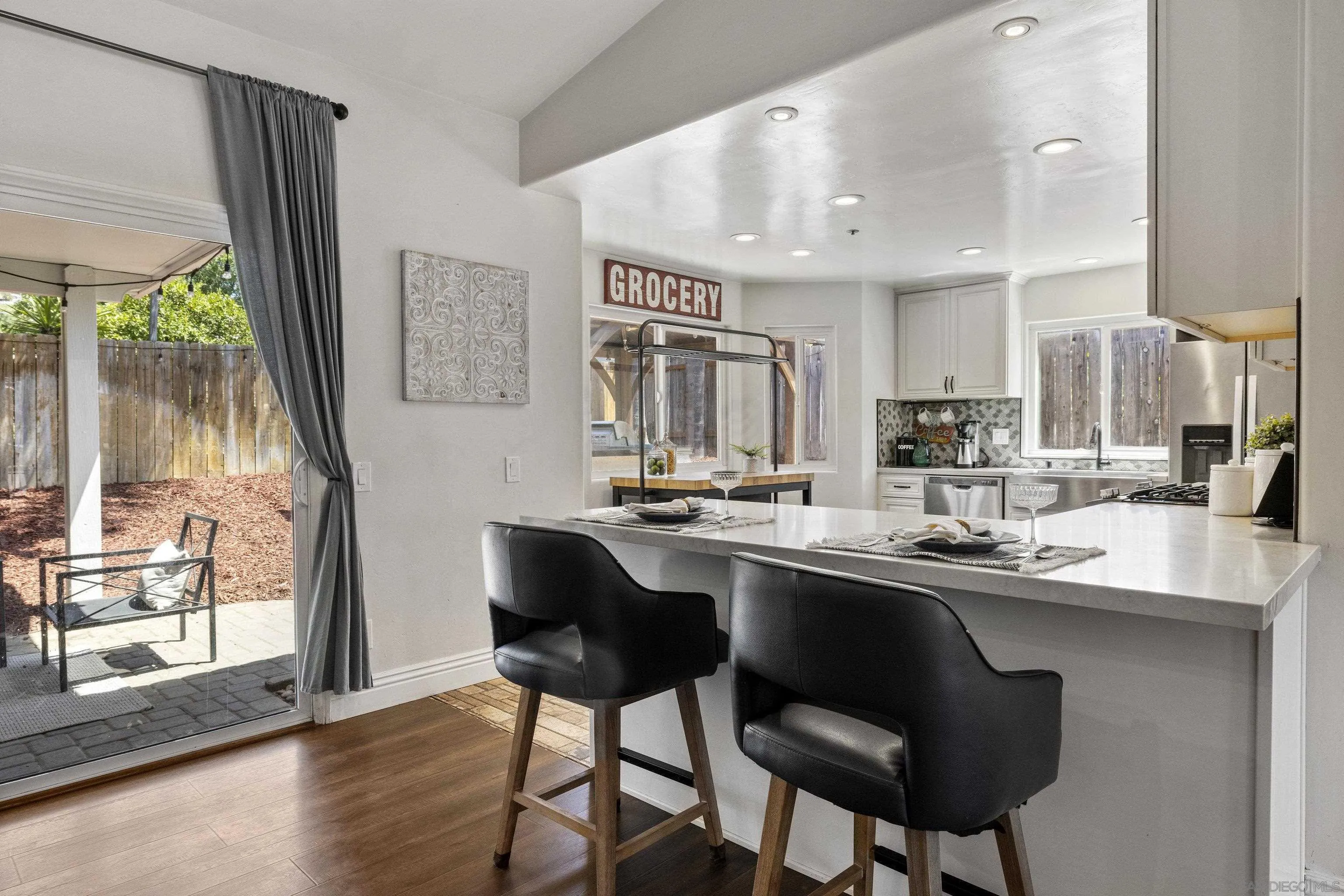 3127 Rio Way Spring Valley, CA 91977 - Photo 15 of 45 a kitchen with stainless steel appliances a sink and a large window
