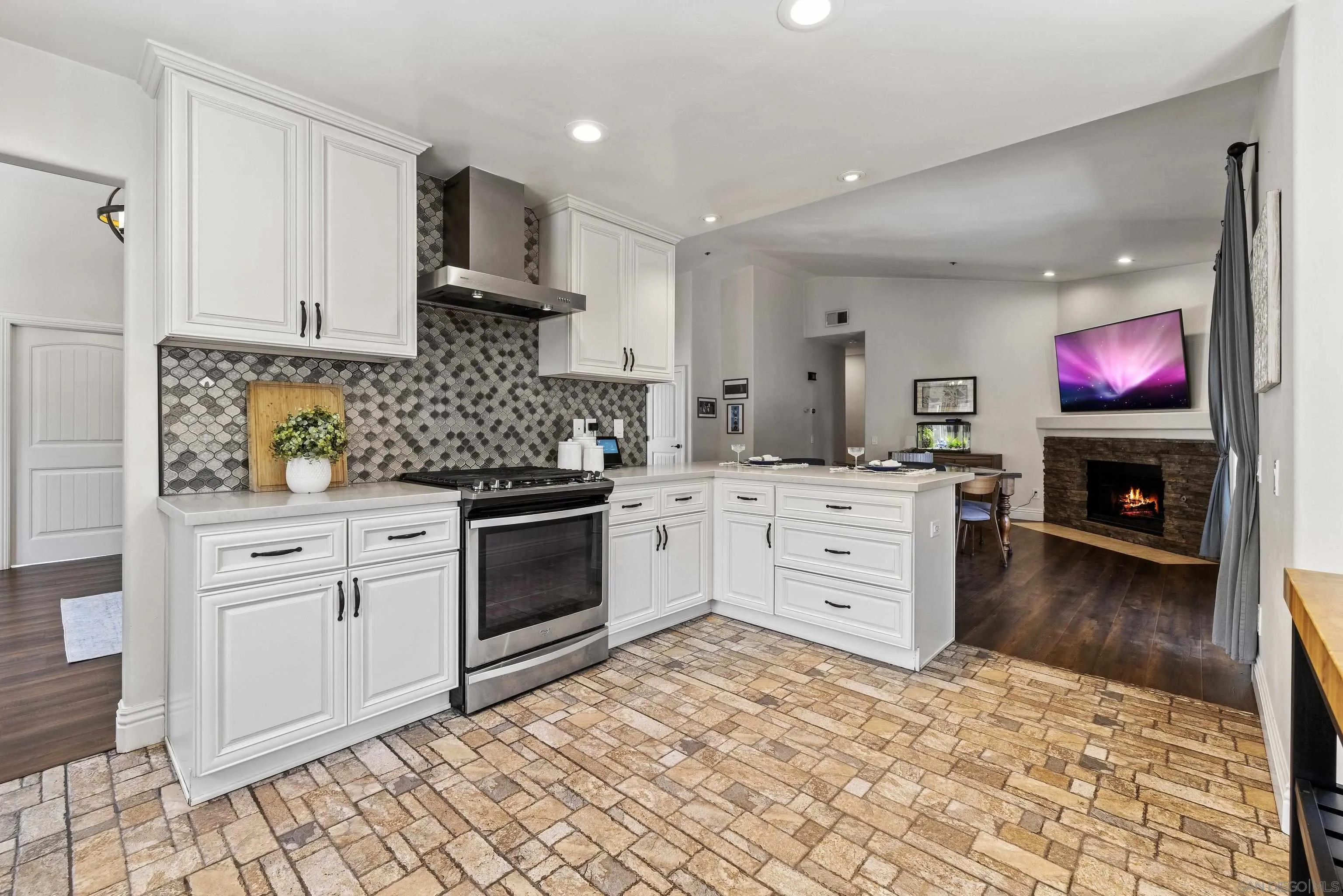 3127 Rio Way Spring Valley, CA 91977 - Photo 18 of 45 a kitchen with white cabinets and appliances