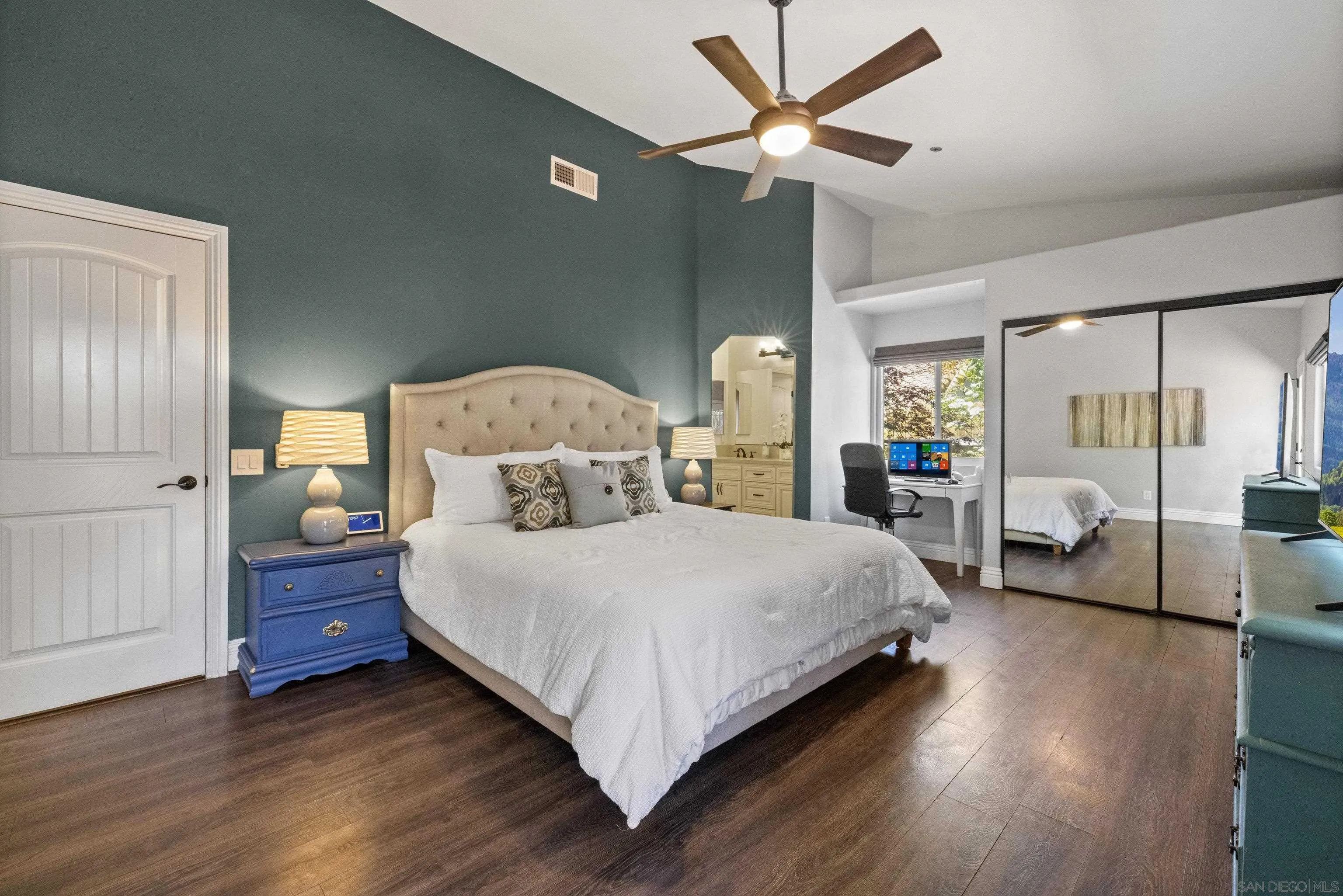 3127 Rio Way Spring Valley, CA 91977 - Photo 21 of 45 a bedroom with a bed chandelier and a window