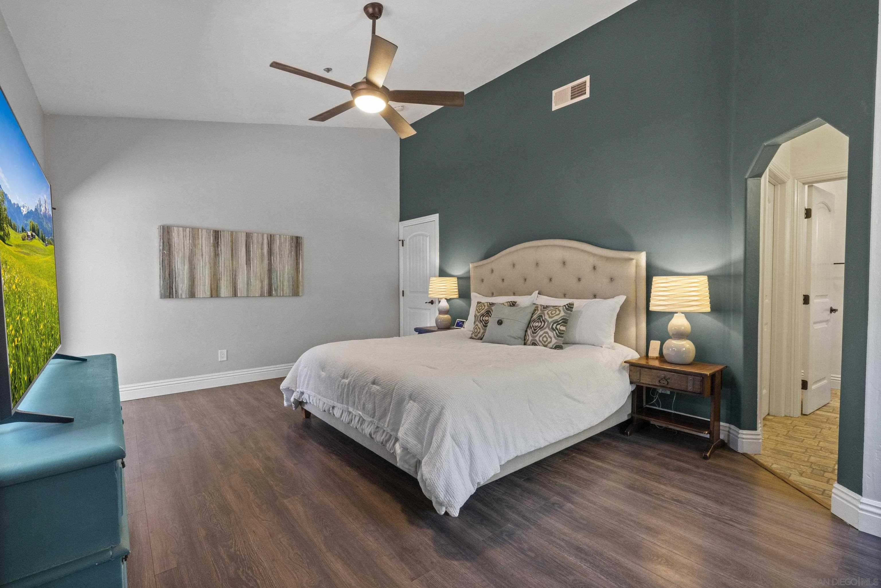 3127 Rio Way Spring Valley, CA 91977 - Photo 23 of 45 a bedroom with a bed and a chandelier