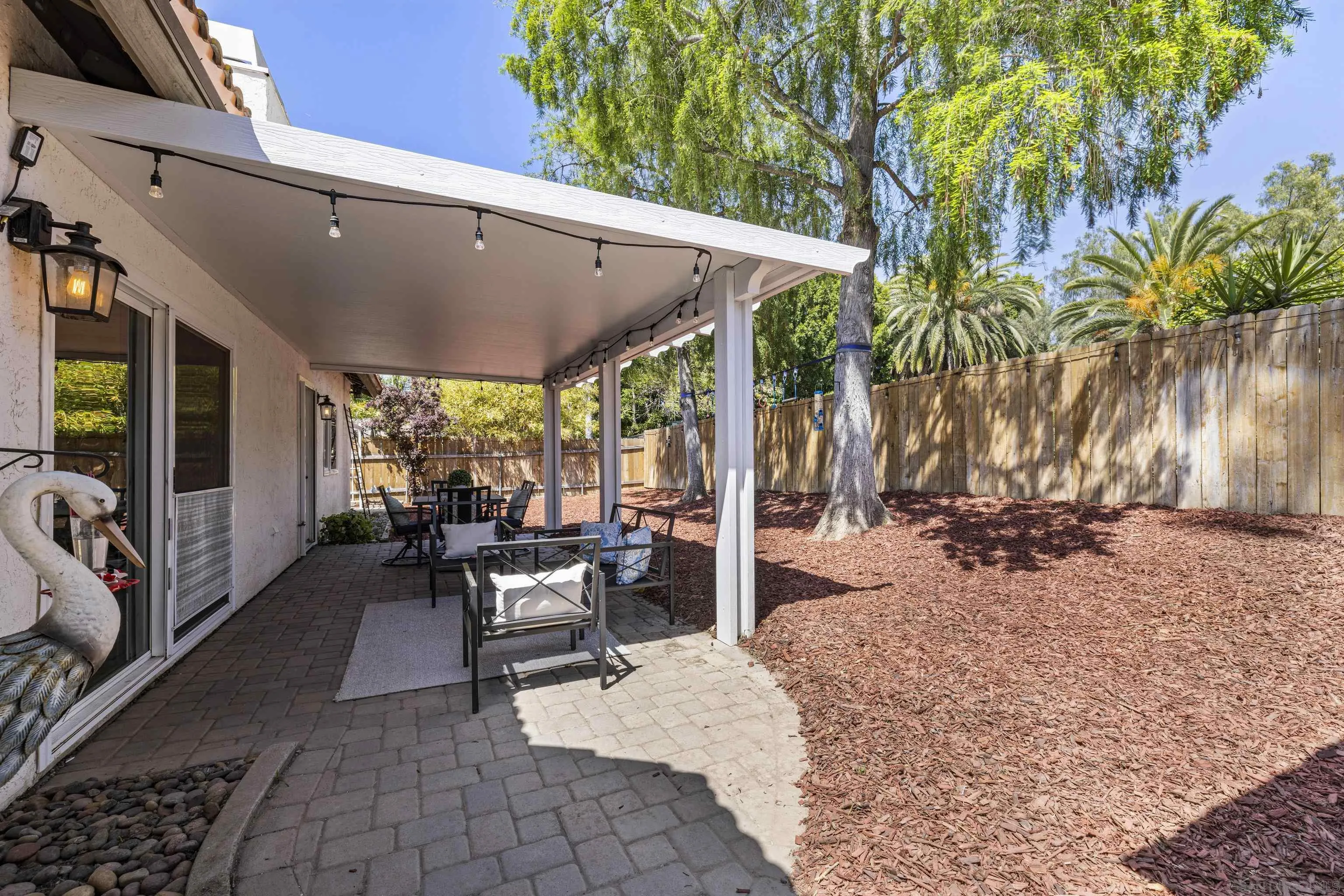3127 Rio Way Spring Valley, CA 91977 - Photo 38 of 45 a view of a patio with a table chairs and a potted plant