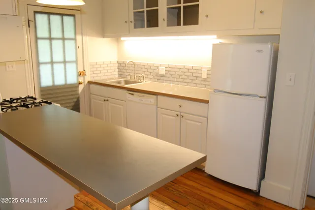 a view of a kitchen with a sink