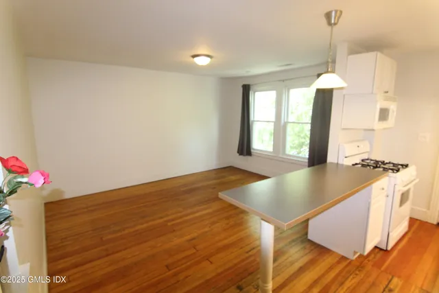 a view of kitchen with furniture and window