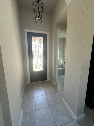 a bedroom with a bed and cabinets
