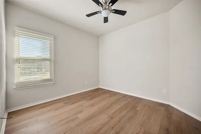 a bathroom with a sink a toilet and a large mirror