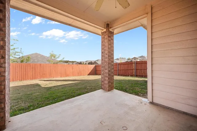a view of a house with a yard and balcony