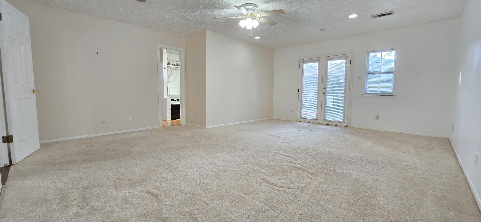 19426 Lockridge Drive Spring, TX 77373 - Photo 11 of 44 a view of an empty room with a chandelier fan