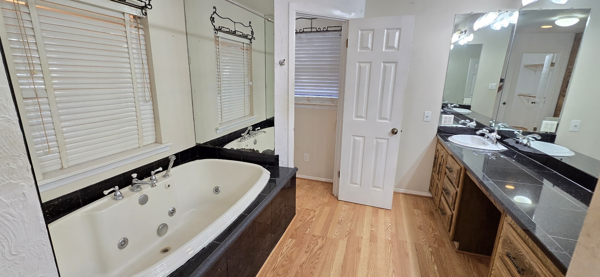 19426 Lockridge Drive Spring, TX 77373 - Photo 12 of 44 a bathroom with a tub sink and mirror
