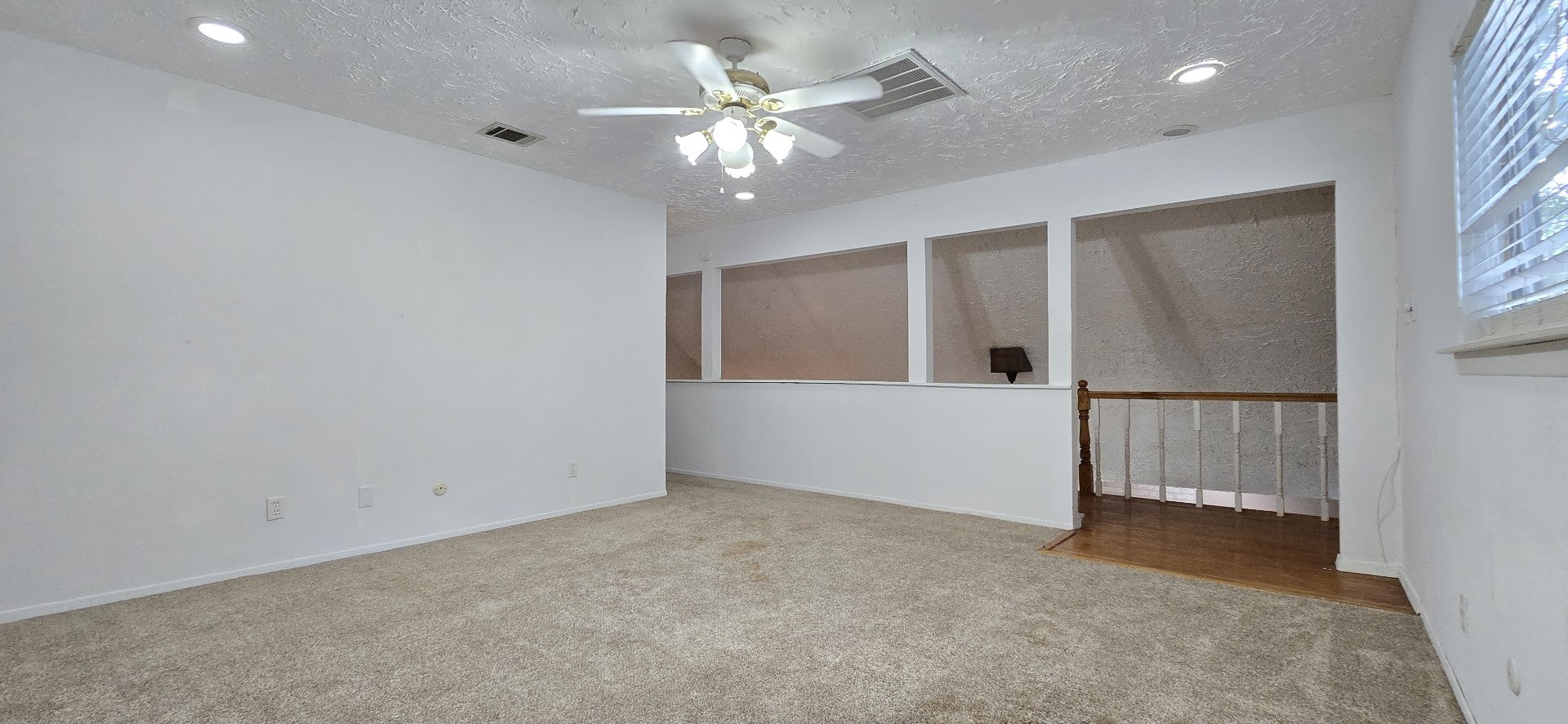 19426 Lockridge Drive Spring, TX 77373 - Photo 22 of 44 an empty room with windows and cabinet