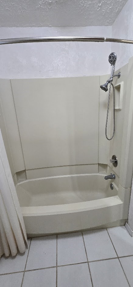 19426 Lockridge Drive Spring, TX 77373 - Photo 27 of 44 a bathroom with a shower and a bath tub