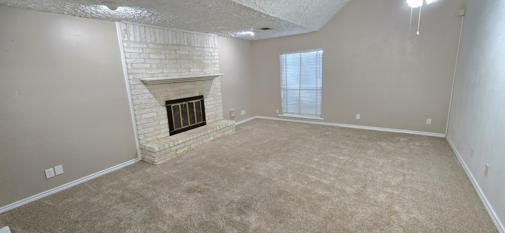 19426 Lockridge Drive Spring, TX 77373 - Photo 4 of 44 an empty room with fireplace and windows