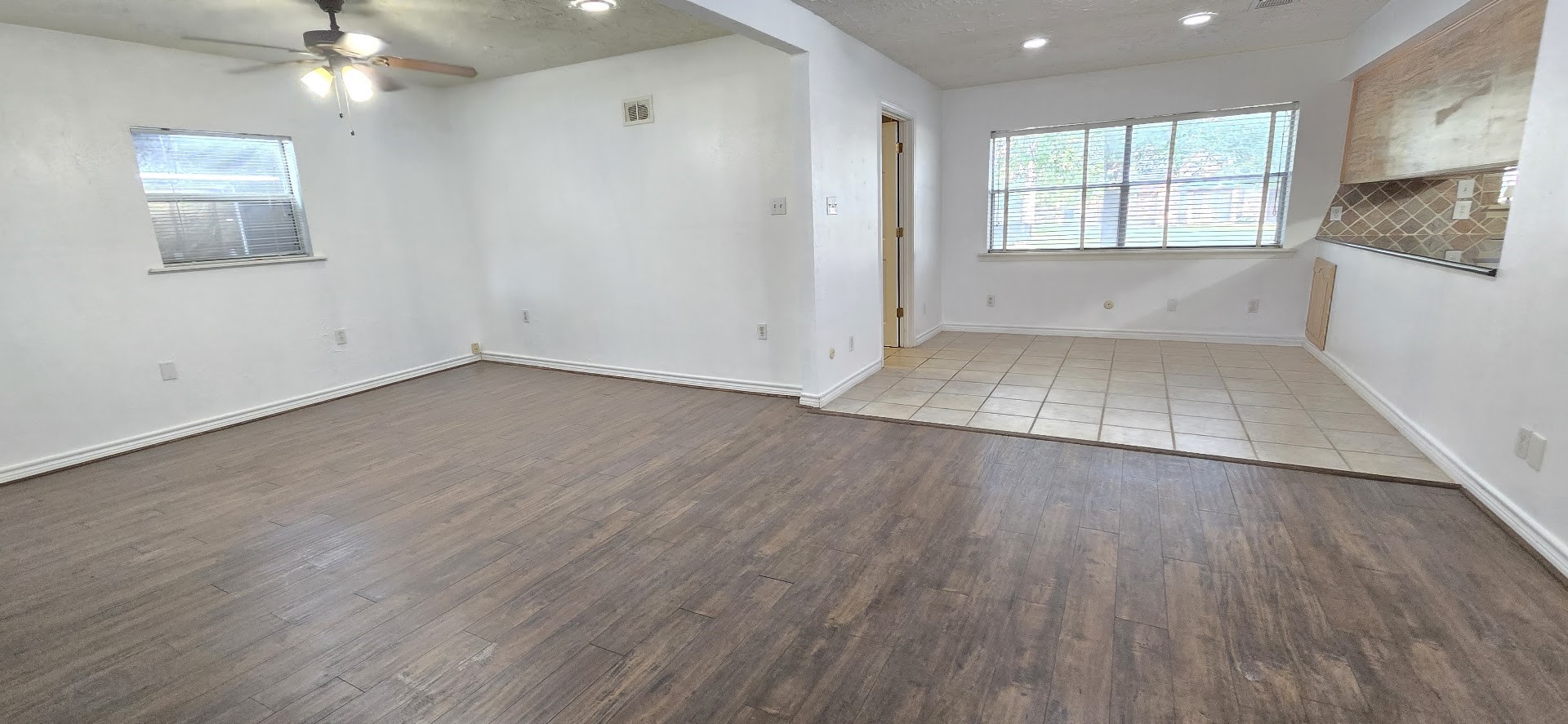 19426 Lockridge Drive Spring, TX 77373 - Photo 8 of 44 an empty room with wooden floor and windows