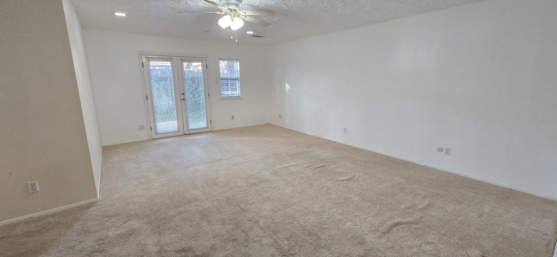 19426 Lockridge Drive Spring, TX 77373 - Photo 10 of 44 an empty room with stairs and wooden floor
