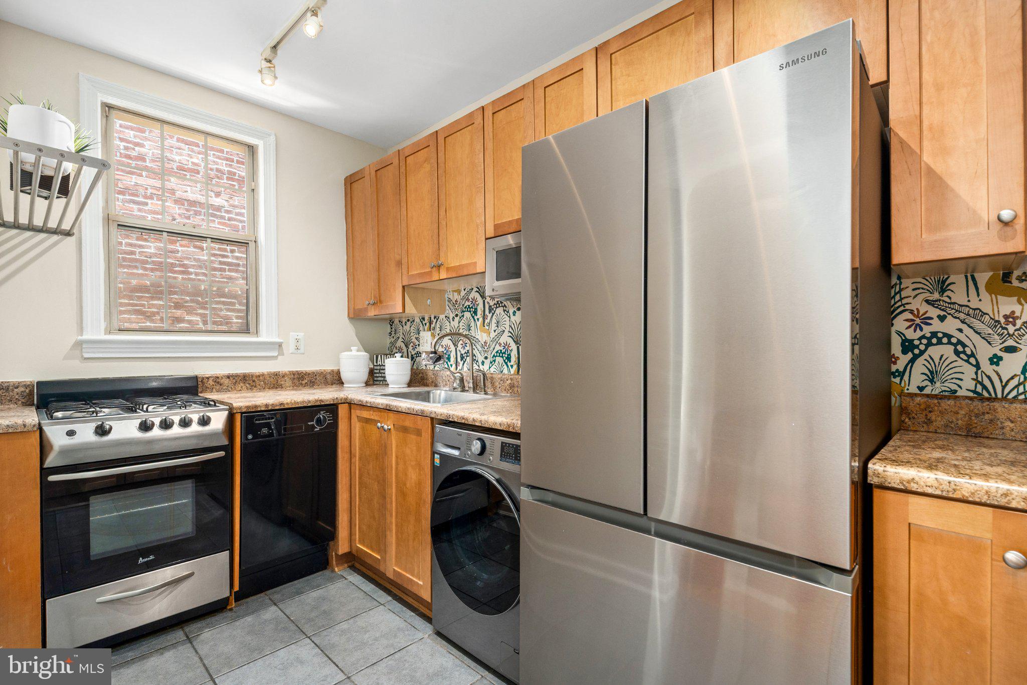 1439 Euclid Street Northwest, Unit 204 Washington, DC 20009 - Photo 9 of 12 Modern kitchen with stylish finishes.