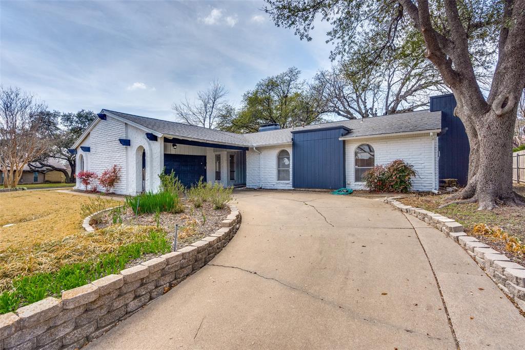 15642 Overmead Circle Dallas, TX 75248 - Photo 23 of 24 a front view of house with yard and green space
