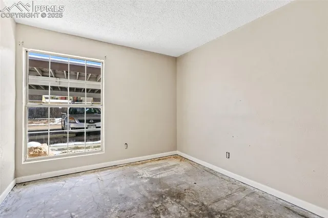 a view of empty room with windows