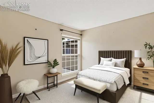 a bedroom with bed and a window