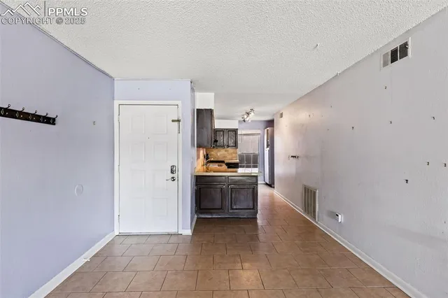 a kitchen with stainless steel appliances a refrigerator and a stove