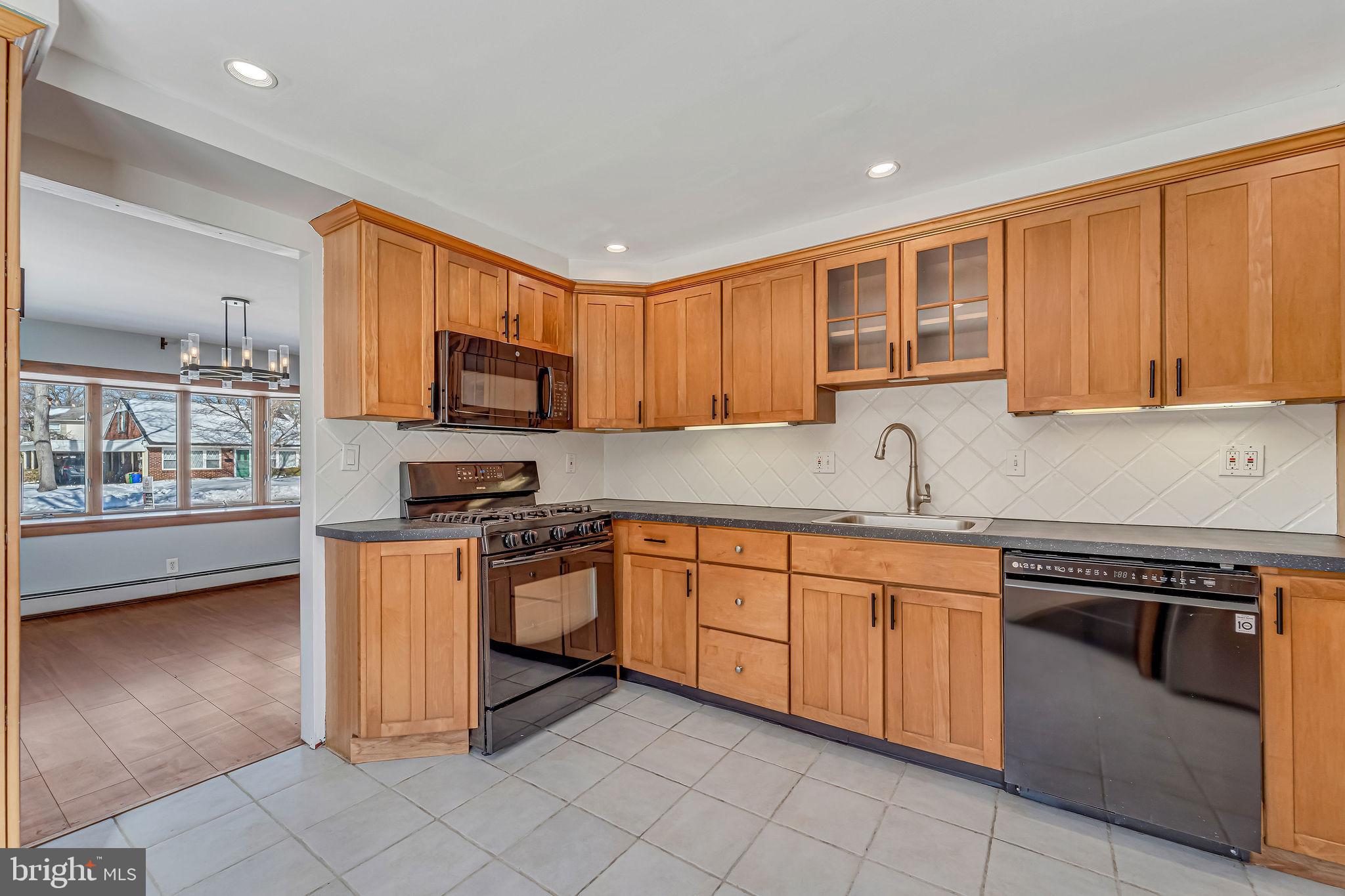 342 Tavistock Boulevard Haddonfield, NJ 08033 - Photo 13 of 32 Modern kitchen with warm wood cabinetry.