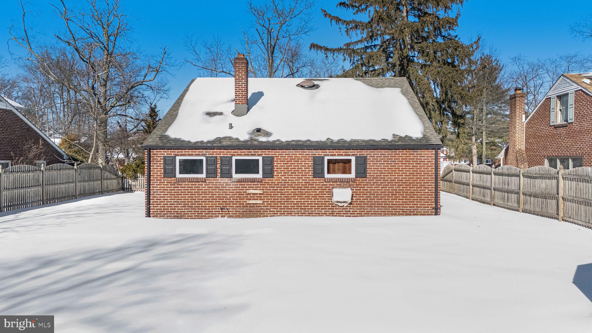 342 Tavistock Boulevard Haddonfield, NJ 08033 - Photo 32 of 32 Charming brick home nestled in winter's embrace.
