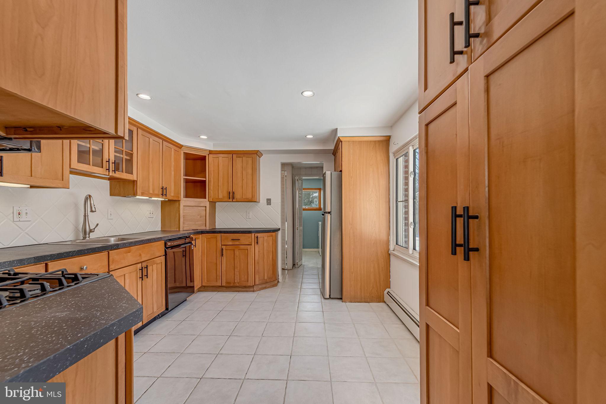 342 Tavistock Boulevard Haddonfield, NJ 08033 - Photo 8 of 32 Spacious kitchen with warm wood cabinetry.