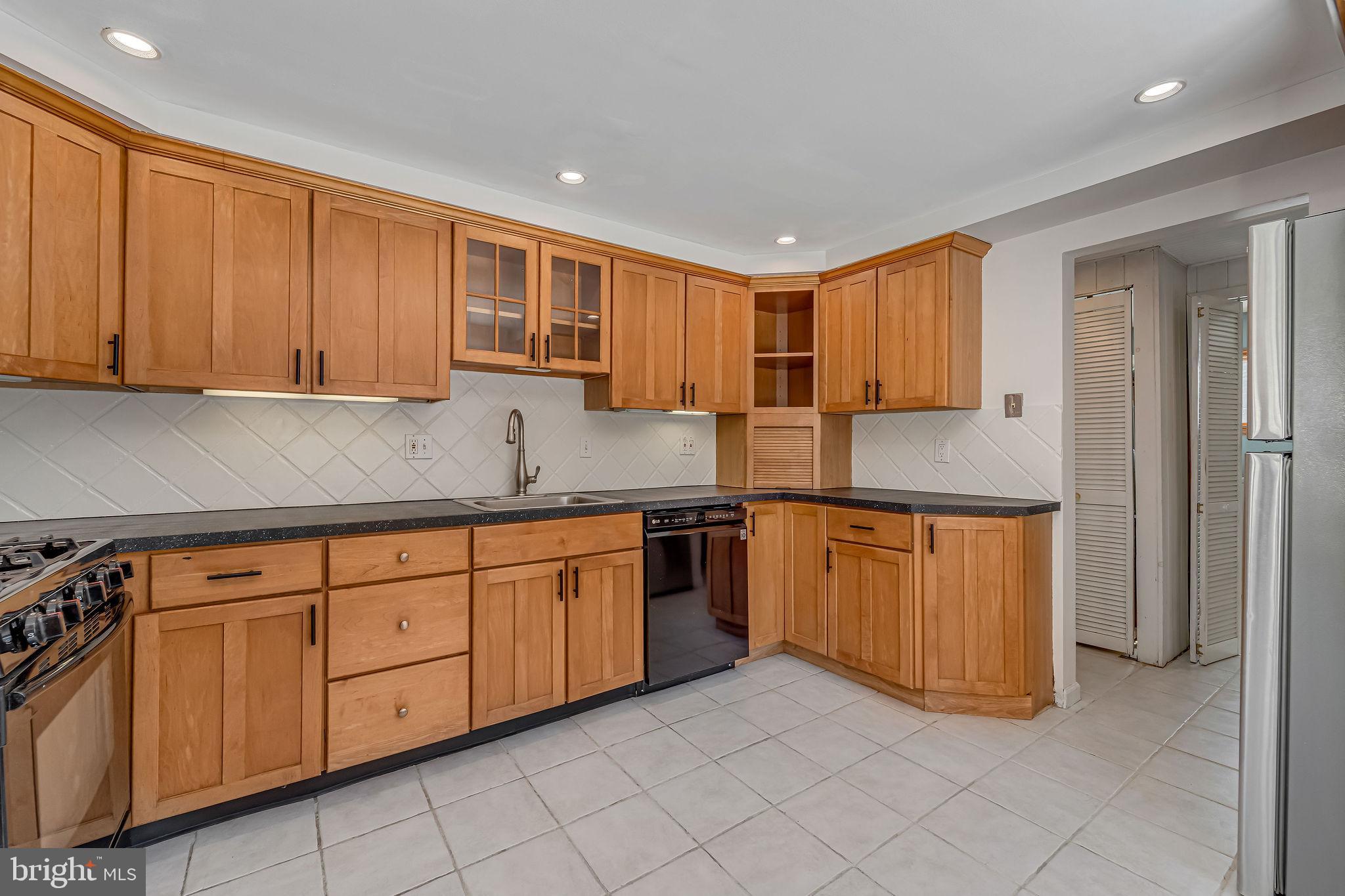 342 Tavistock Boulevard Haddonfield, NJ 08033 - Photo 10 of 32 Modern kitchen with warm wood cabinetry.