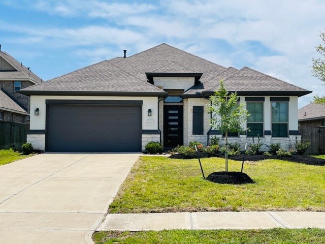 13710 Saxon Cliff Lane Rosharon, TX 77583 - Photo 1 of 20 a house view with a garden space