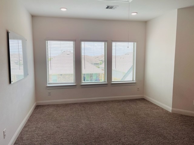13710 Saxon Cliff Lane Rosharon, TX 77583 - Photo 13 of 20 an empty room with windows