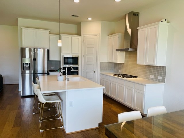 13710 Saxon Cliff Lane Rosharon, TX 77583 - Photo 6 of 20 a kitchen with stainless steel appliances granite countertop a sink refrigerator and cabinets