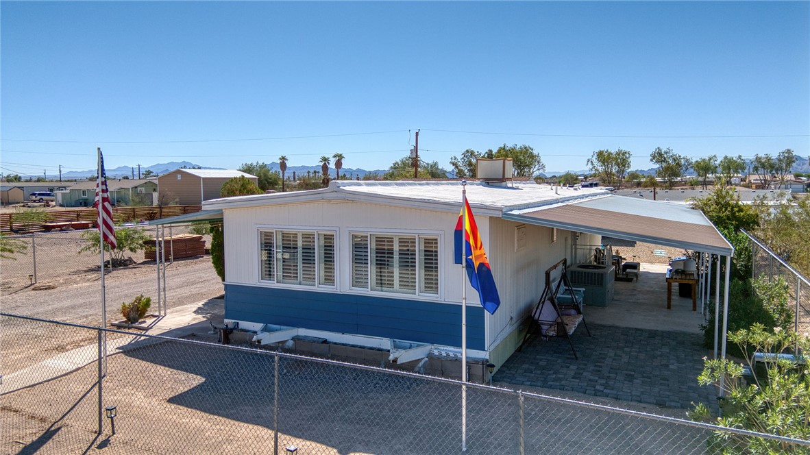 4826 Powell Lake Road Topock, AZ 86436 - Photo 2 of 58 a view of a patio with a table and chairs