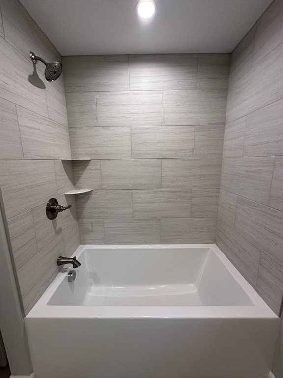 50 Farm Street Bellingham, MA 02019 - Photo 12 of 16 a bathroom with a bathtub