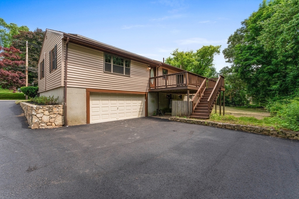 50 Farm Street Bellingham, MA 02019 - Photo 14 of 16 a view of a house with a yard