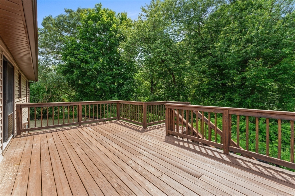 50 Farm Street Bellingham, MA 02019 - Photo 15 of 16 a view of balcony with wooden floor and fence