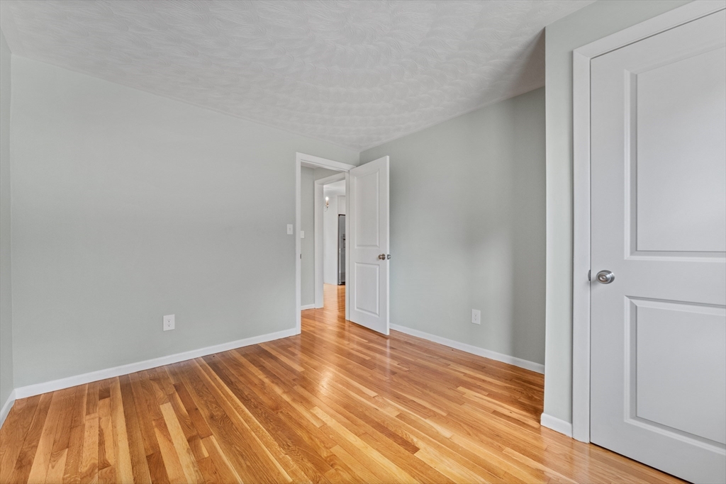 50 Farm Street Bellingham, MA 02019 - Photo 10 of 16 a view of an empty room with wooden floor