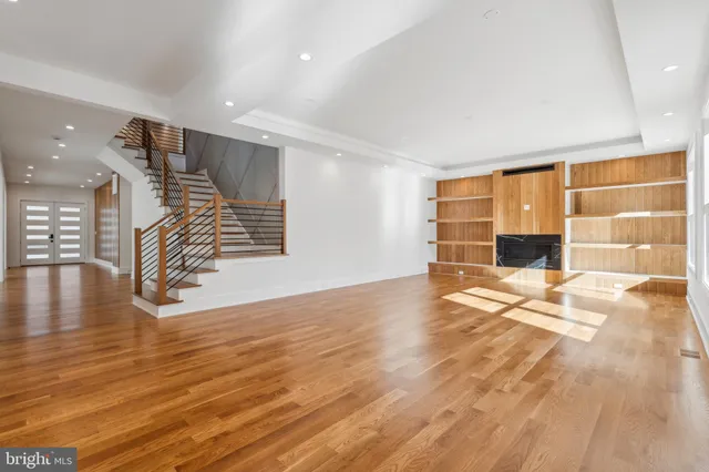 a view of a refrigerator in kitchen and wooden floor