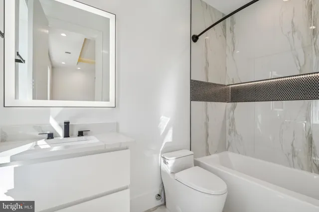 a kitchen with stove and refrigerator