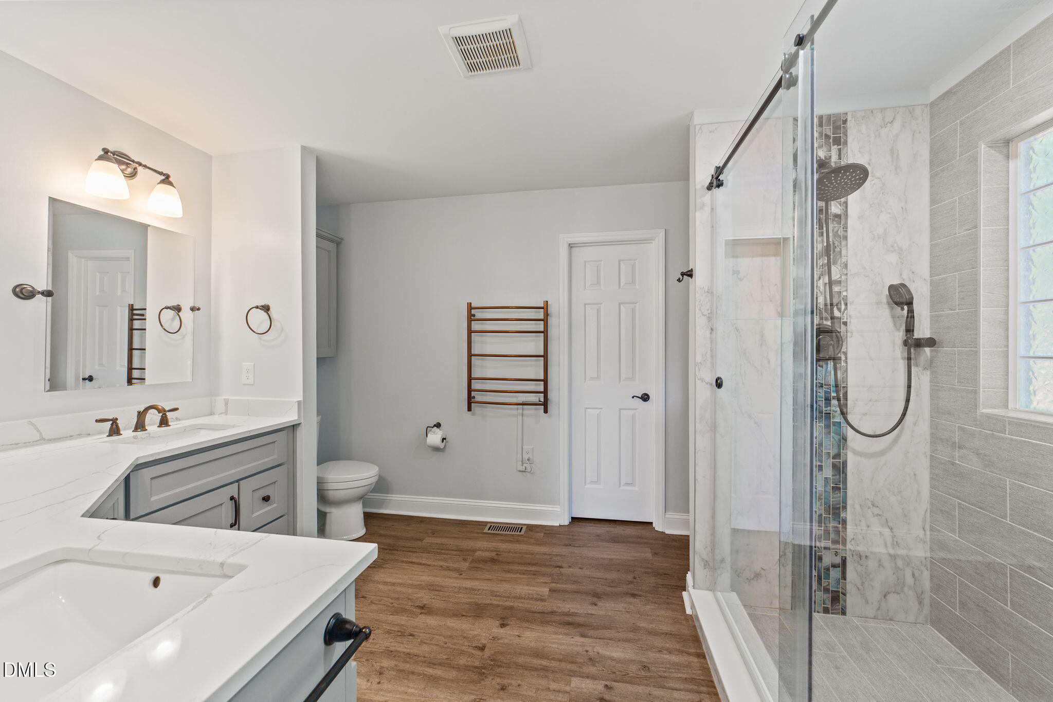 6820 Oviedo Drive Raleigh, NC 27603 - Photo 24 of 50 a bathroom with a tub sink shower and mirror