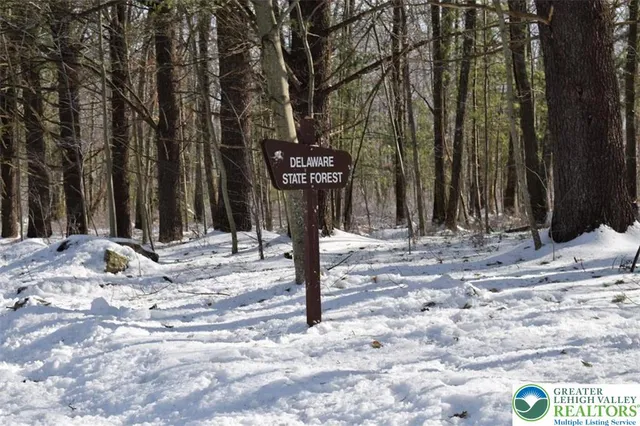 a sign board with a yard