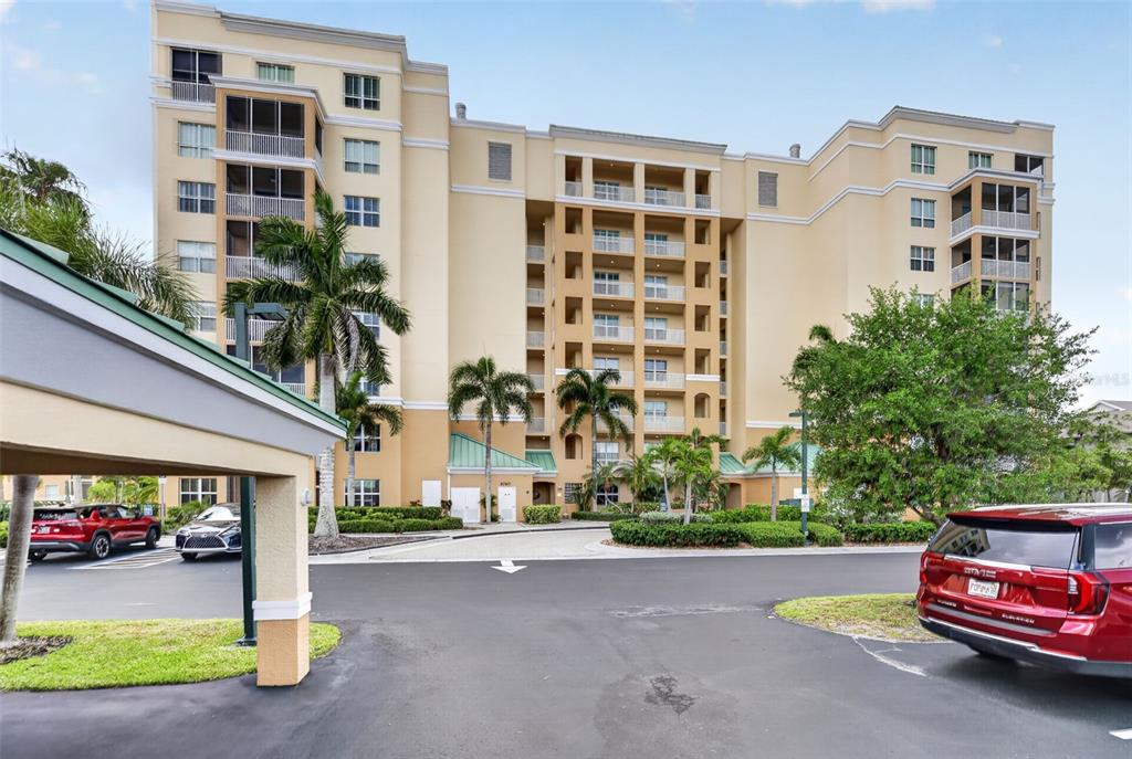 2060 Matecumbe Key Road, Unit 2506 Punta Gorda, FL 33955 - Photo 33 of 38 a car parked in front of a building