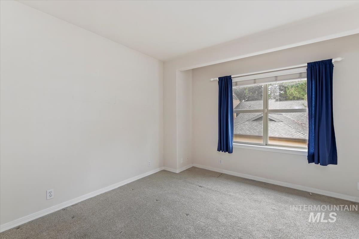 812 East Riverpark Lane Boise, ID 83706 - Photo 17 of 24 Empty room featuring baseboards and carpet floors