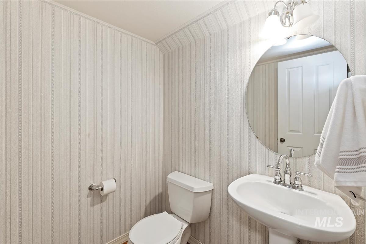 812 East Riverpark Lane Boise, ID 83706 - Photo 10 of 24 Half bath featuring wallpapered walls