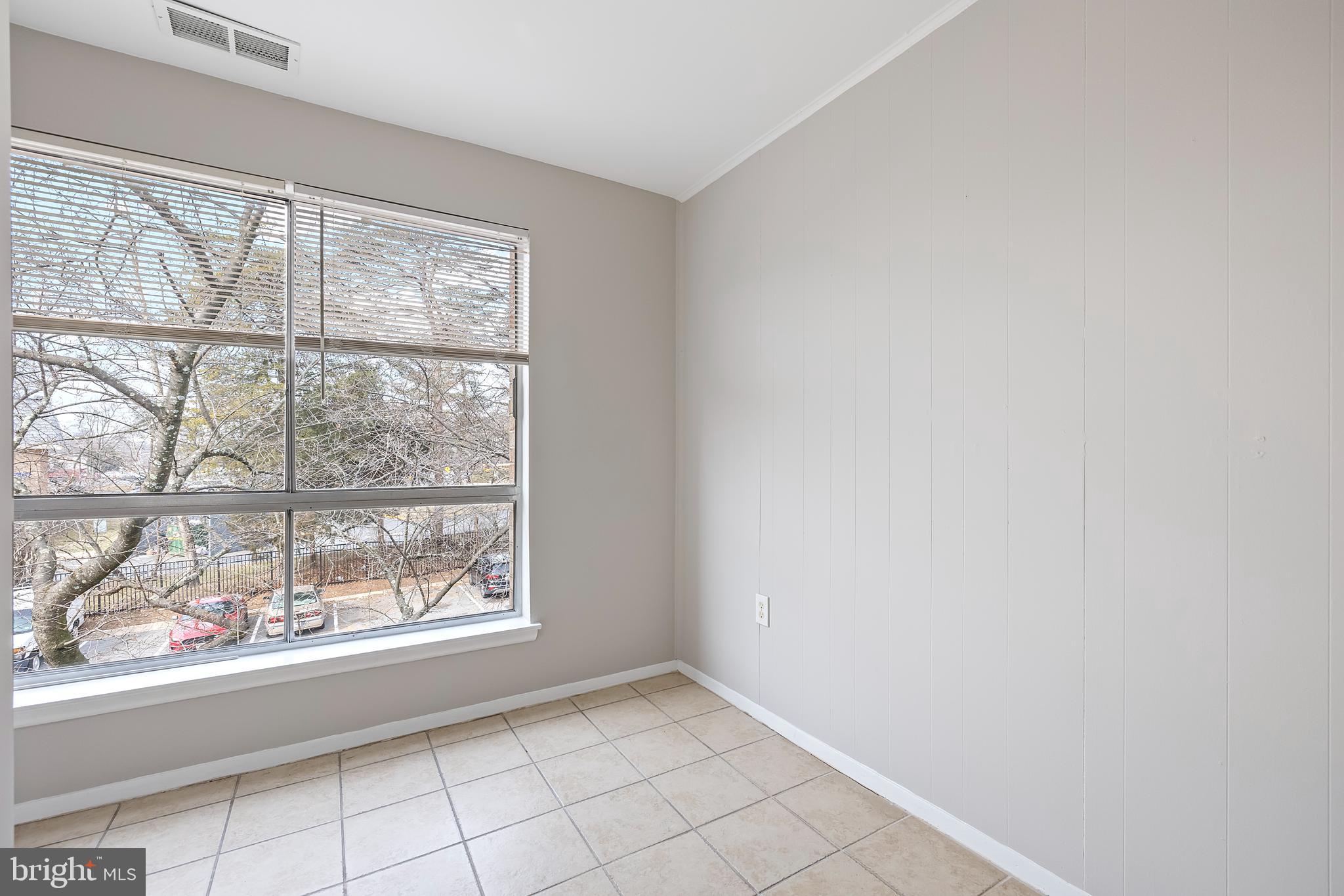 3902 Bel Pre Road, Unit 39028 Silver Spring, MD 20906 - Photo 13 of 31 an empty room with windows