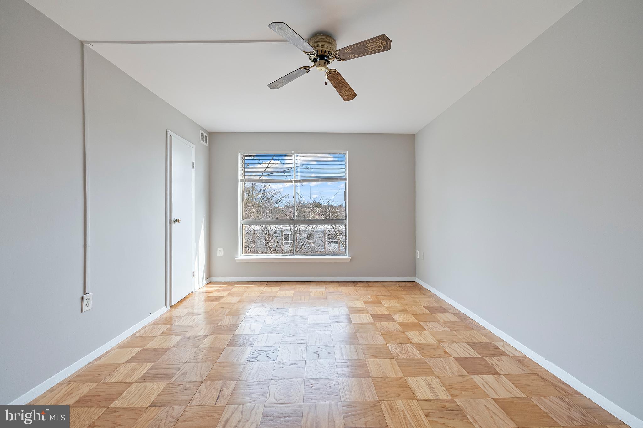 3902 Bel Pre Road, Unit 39028 Silver Spring, MD 20906 - Photo 16 of 31 a view of an empty room with a window