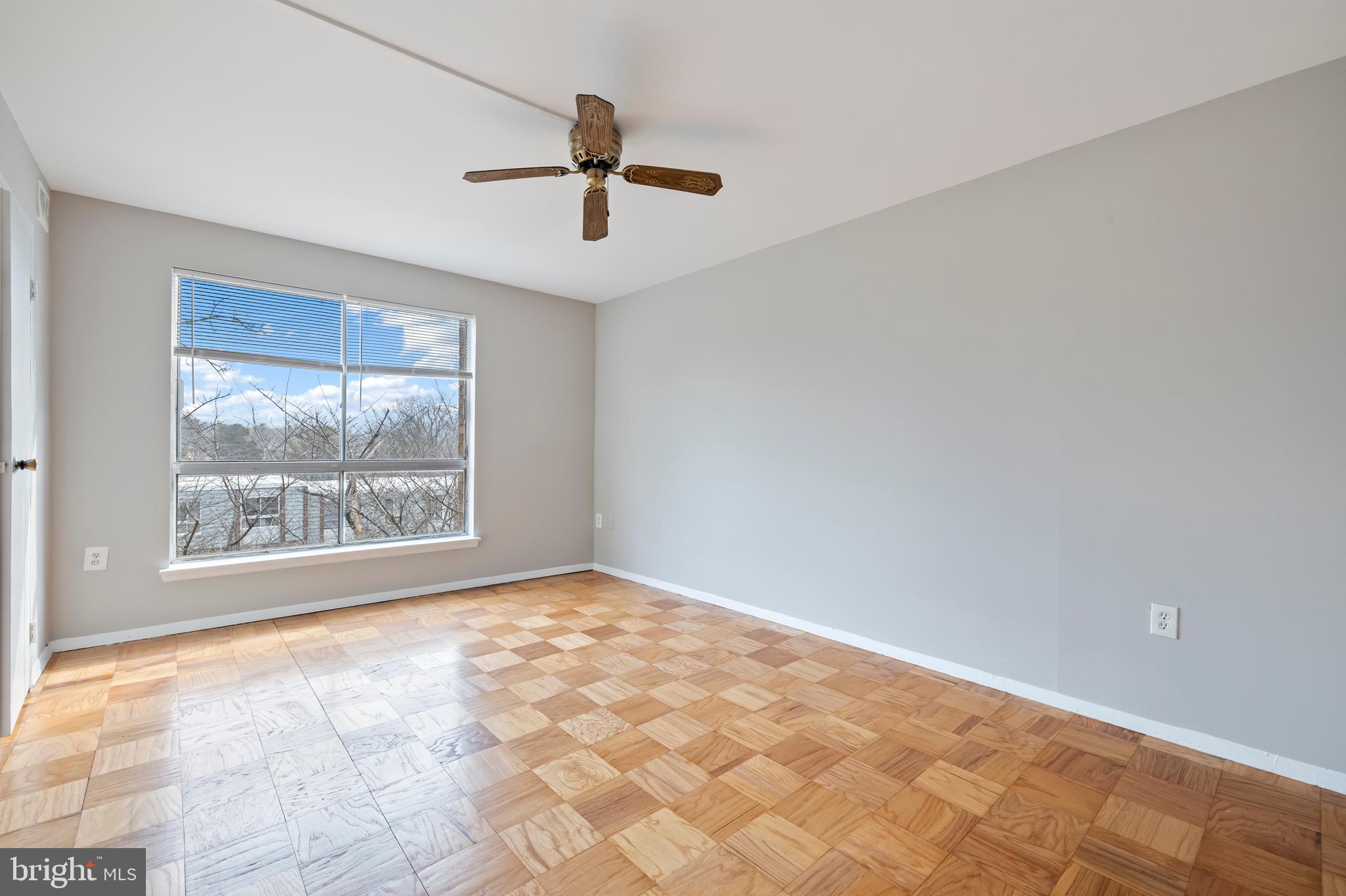 3902 Bel Pre Road, Unit 39028 Silver Spring, MD 20906 - Photo 17 of 31 a view of an empty room with a window