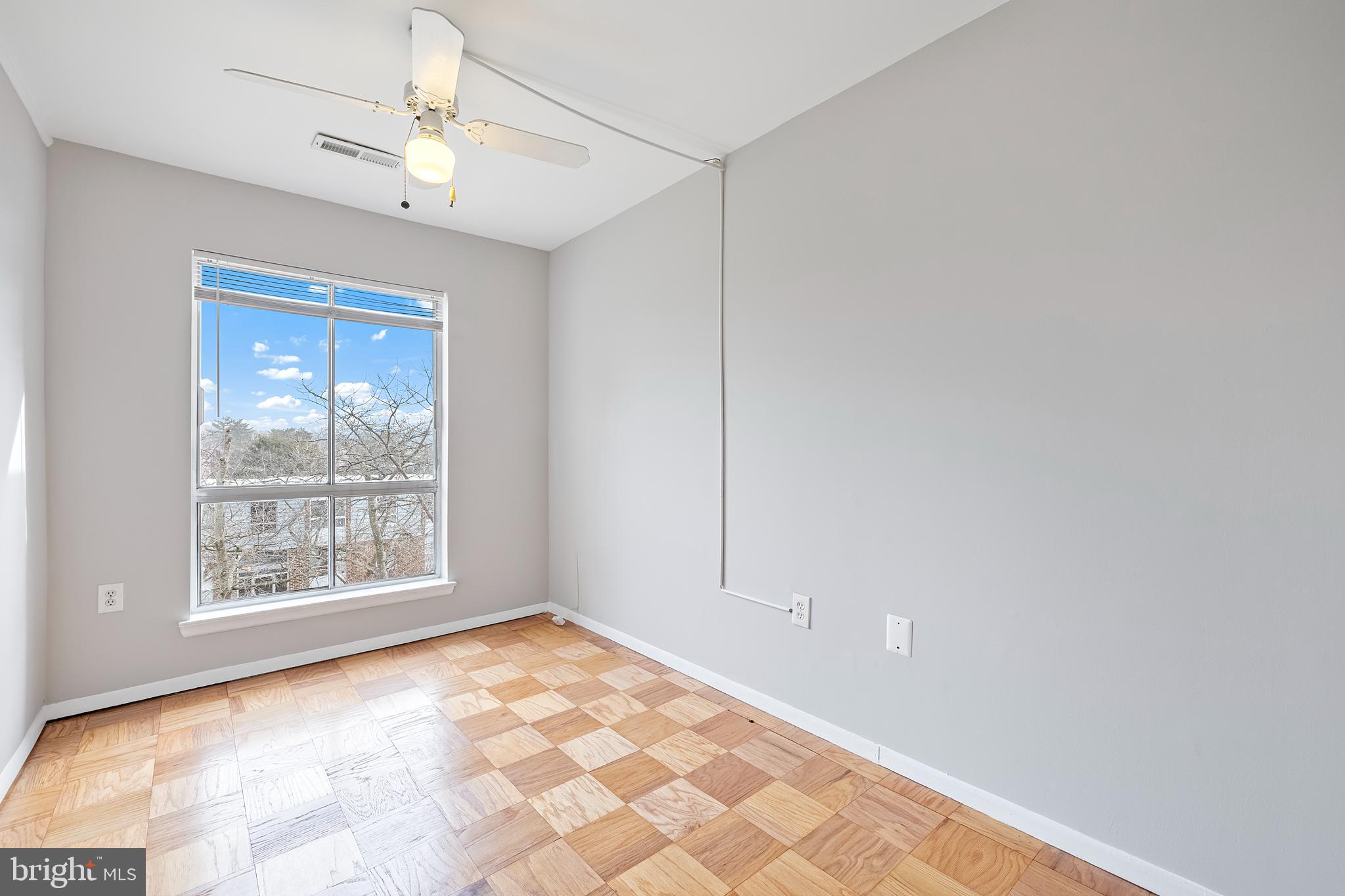 3902 Bel Pre Road, Unit 39028 Silver Spring, MD 20906 - Photo 25 of 31 a view of an empty room with a window
