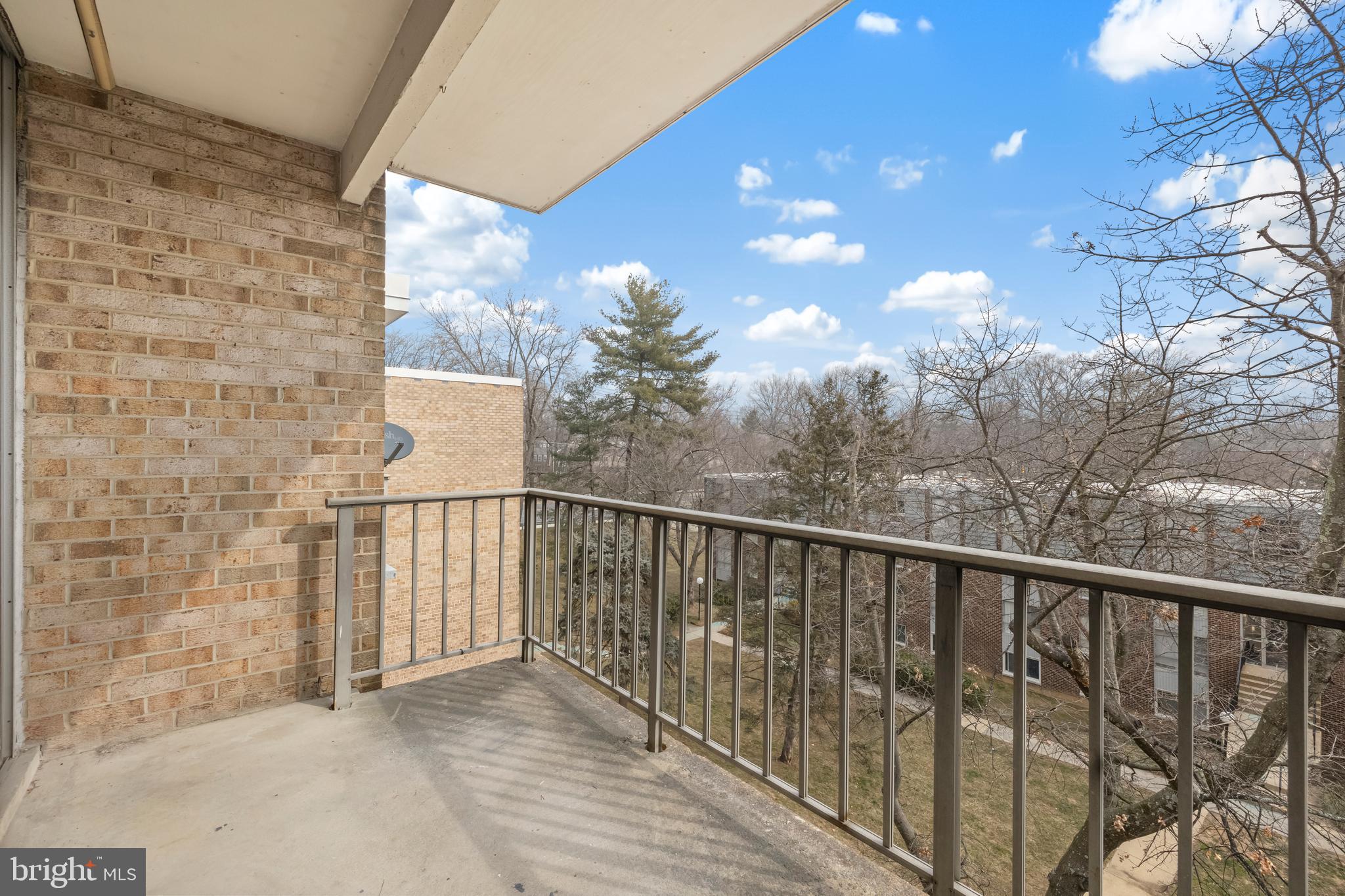 3902 Bel Pre Road, Unit 39028 Silver Spring, MD 20906 - Photo 29 of 31 a view of a balcony with a pot